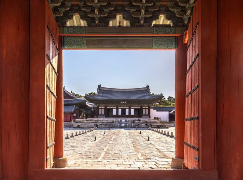 Myeongjeongjeon seen through the wooden Gate Hyehwamun at Changgyeonggung Palace in Seoul