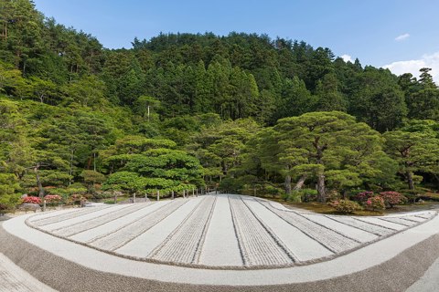 Dry sand Zen garden made of beige stripes a sunny day at Higashiyama Jisho ji Buddhist temple Ginkaku ji Kyoto Japan
